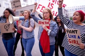 Cropped shot of women protesting in the city